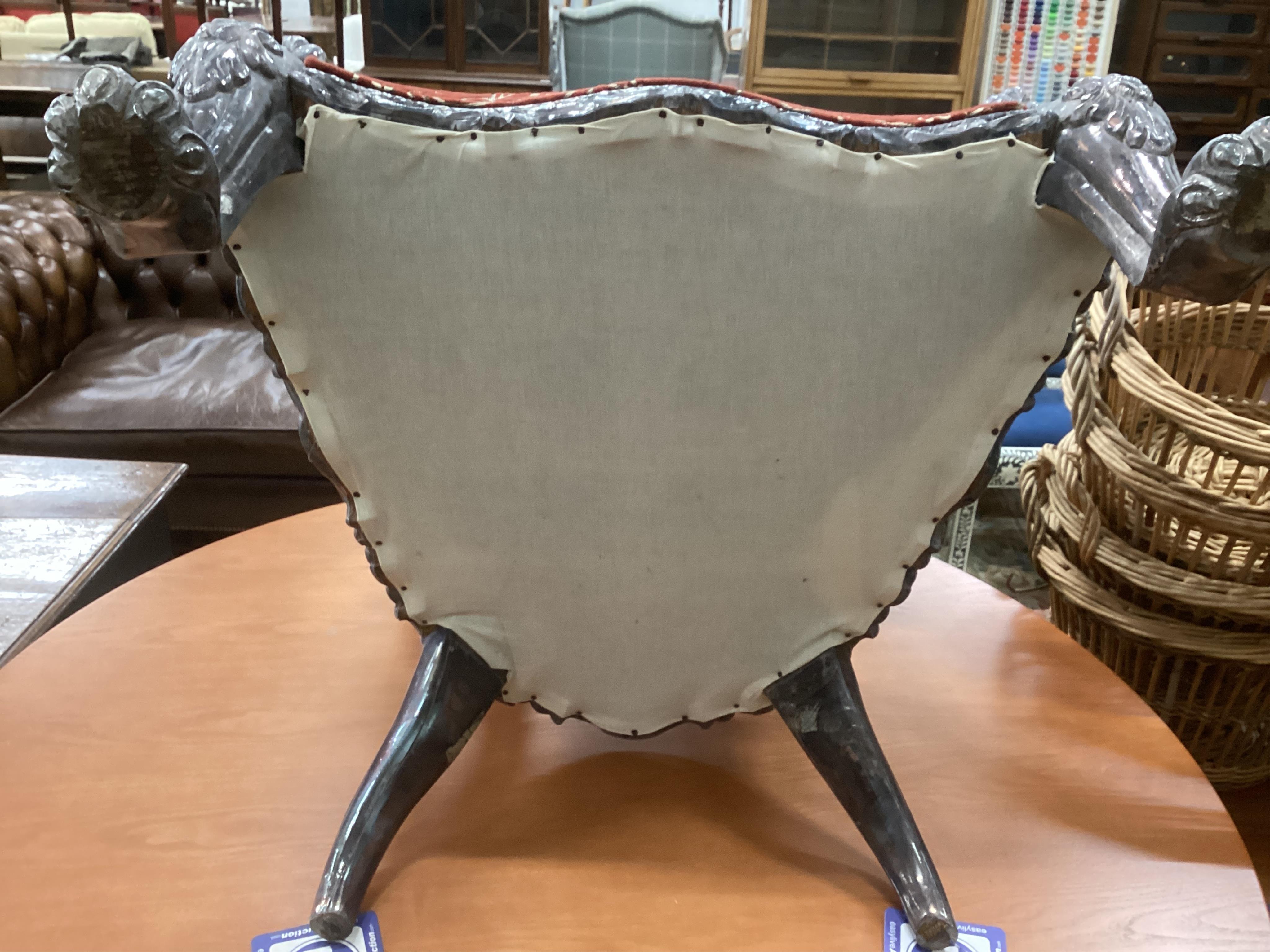 An Indian white metal overlaid armchair, width 72cm, depth 55cm, height 98cm. Condition - good